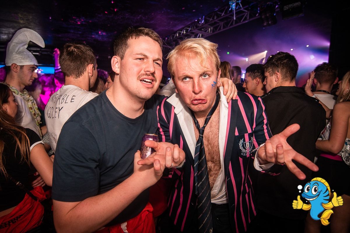 Image may contain: Night Life, Apparel, Clothing, Hat, Party, Night Club, Club, Person, Human