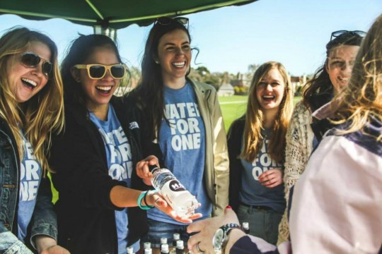H4O ladies selling water bottles at Rugby 7s
