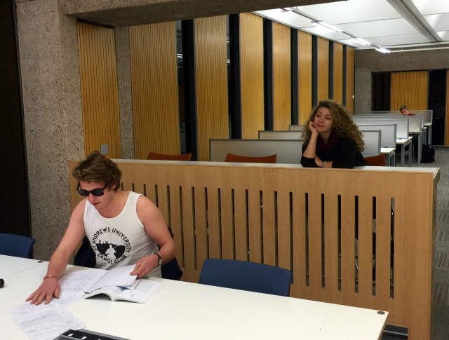 I'm not usually into guys who wear wife beaters... but next to the library's wood panels his pasty arms make him look less douchey!