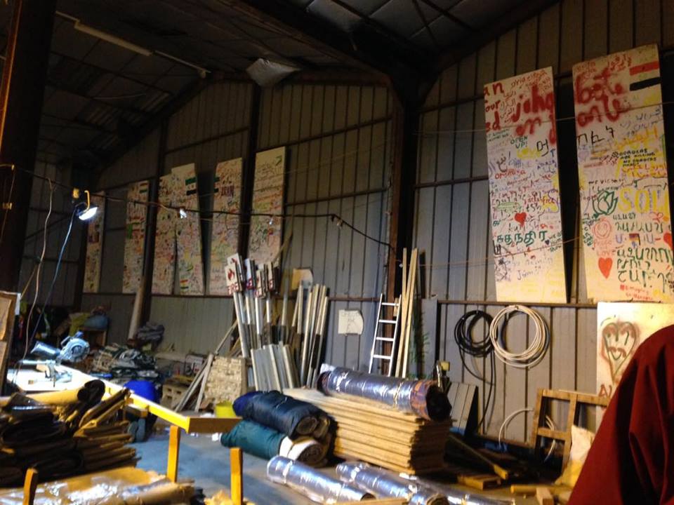 Messages from the refugees hung up in the construction warehouse.