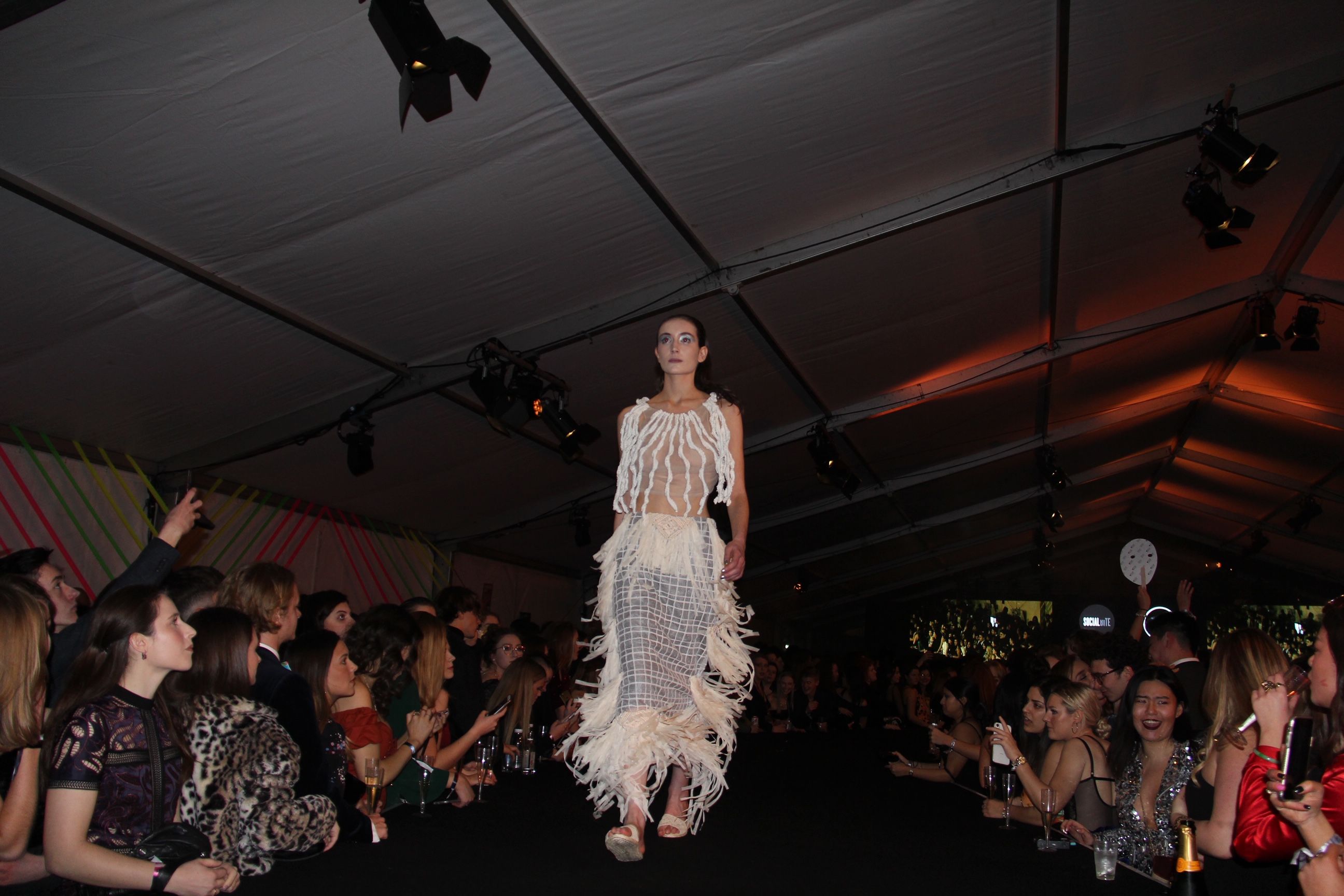 Image may contain: Dance Pose, Runway, Audience, Crowd, Leisure Activities, Evening Dress, Robe, Gown, Fashion, Clothing, Apparel, Person, Human
