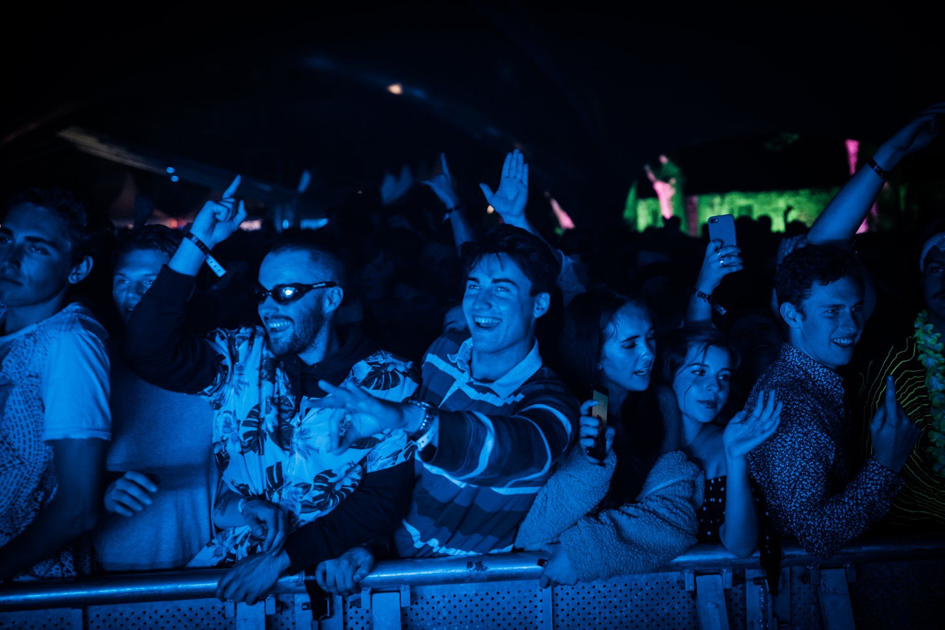 Image may contain: Night Club, Lighting, Audience, Crowd, Club, Night Life, Human, Person