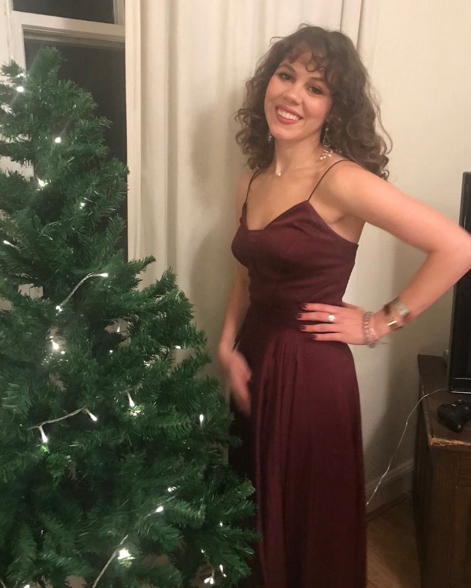 Image may contain: Christmas Tree, Ornament, Abies, Fir, Fashion, Gown, Robe, Evening Dress, Clothing, Apparel, Person, Human, Tree, Plant