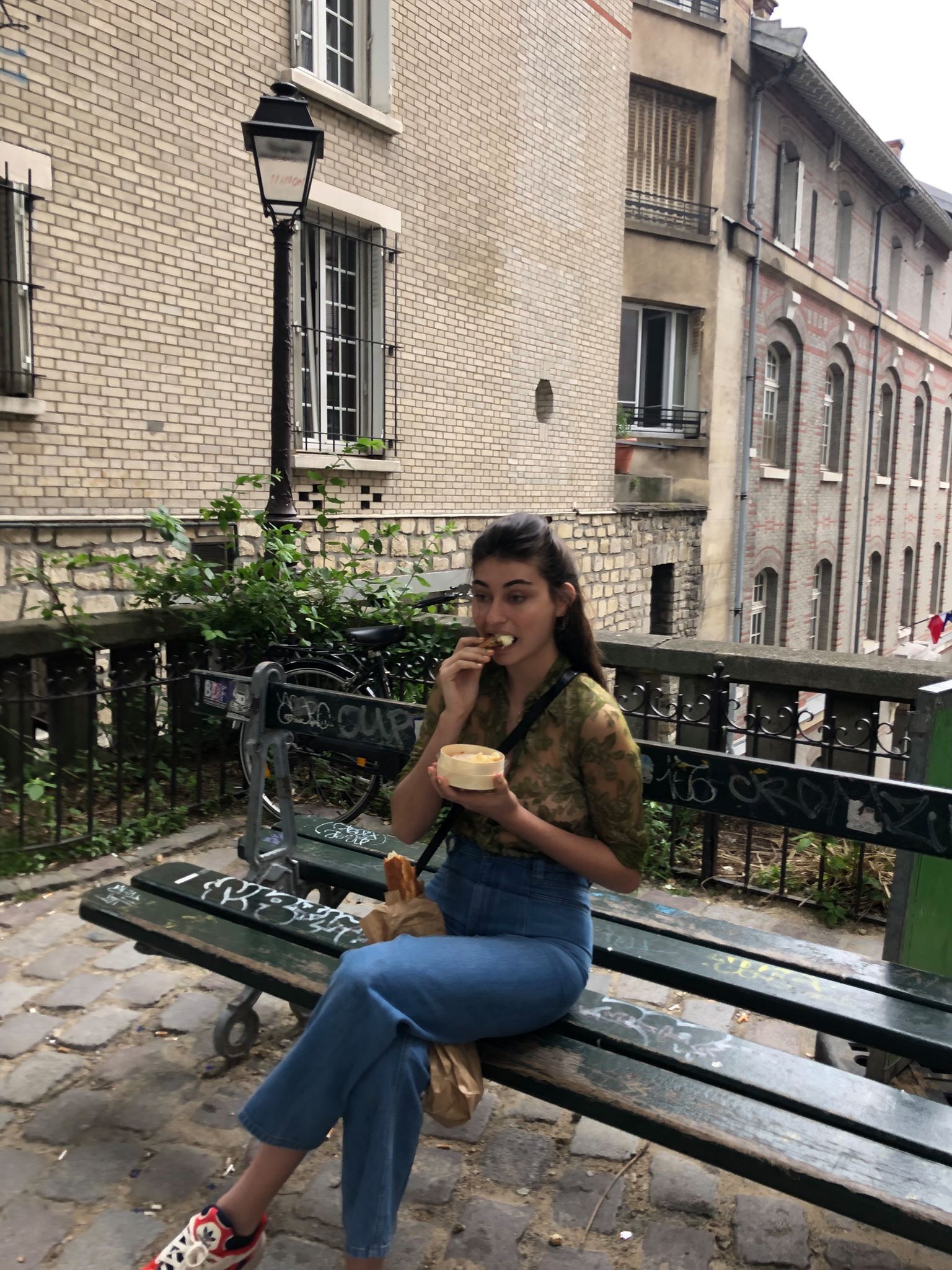 Image may contain: Bench, Furniture, Railing, Flagstone, Denim, Jeans, Sitting, Banister, Handrail, Pants, Human, Person, Clothing, Apparel, Shoe, Footwear
