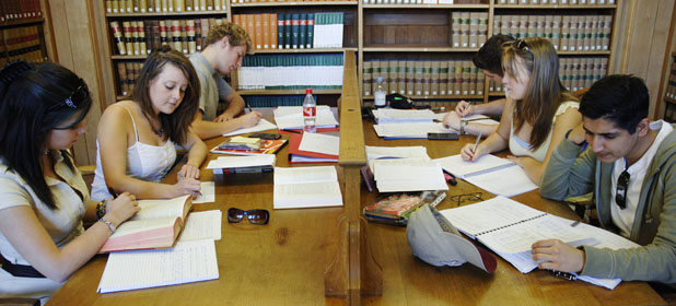 Undergraduates studying in the Law Library