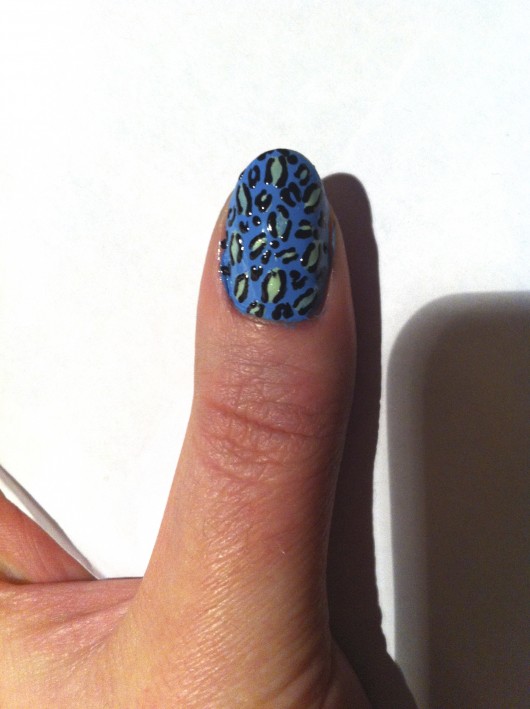Step 4: Complete your leopard spots with the black nail art pen.