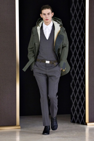 A khaki coverup tones down a more formal look at the Balenciaga Menswear show. Photo: www.gq.com