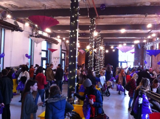 The kilo sale's venue was far too small for the volume of cheesy 80s pop being pumped through the speakers. 