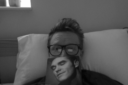 The pseud in bed with his hero.