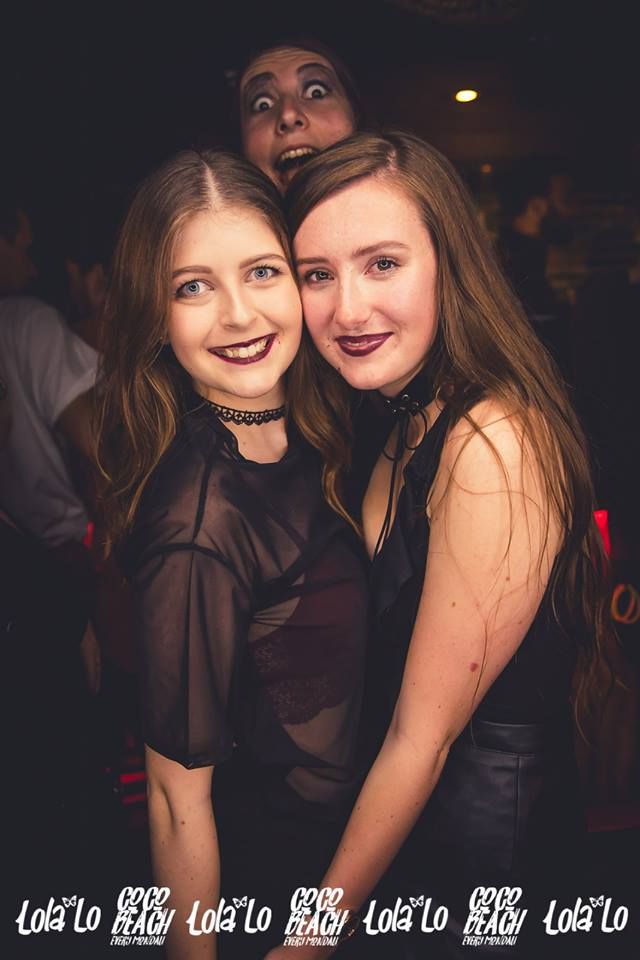 Image may contain: Smile, Portrait, Face, Night Life, Night Club, Club, Human, Person, People