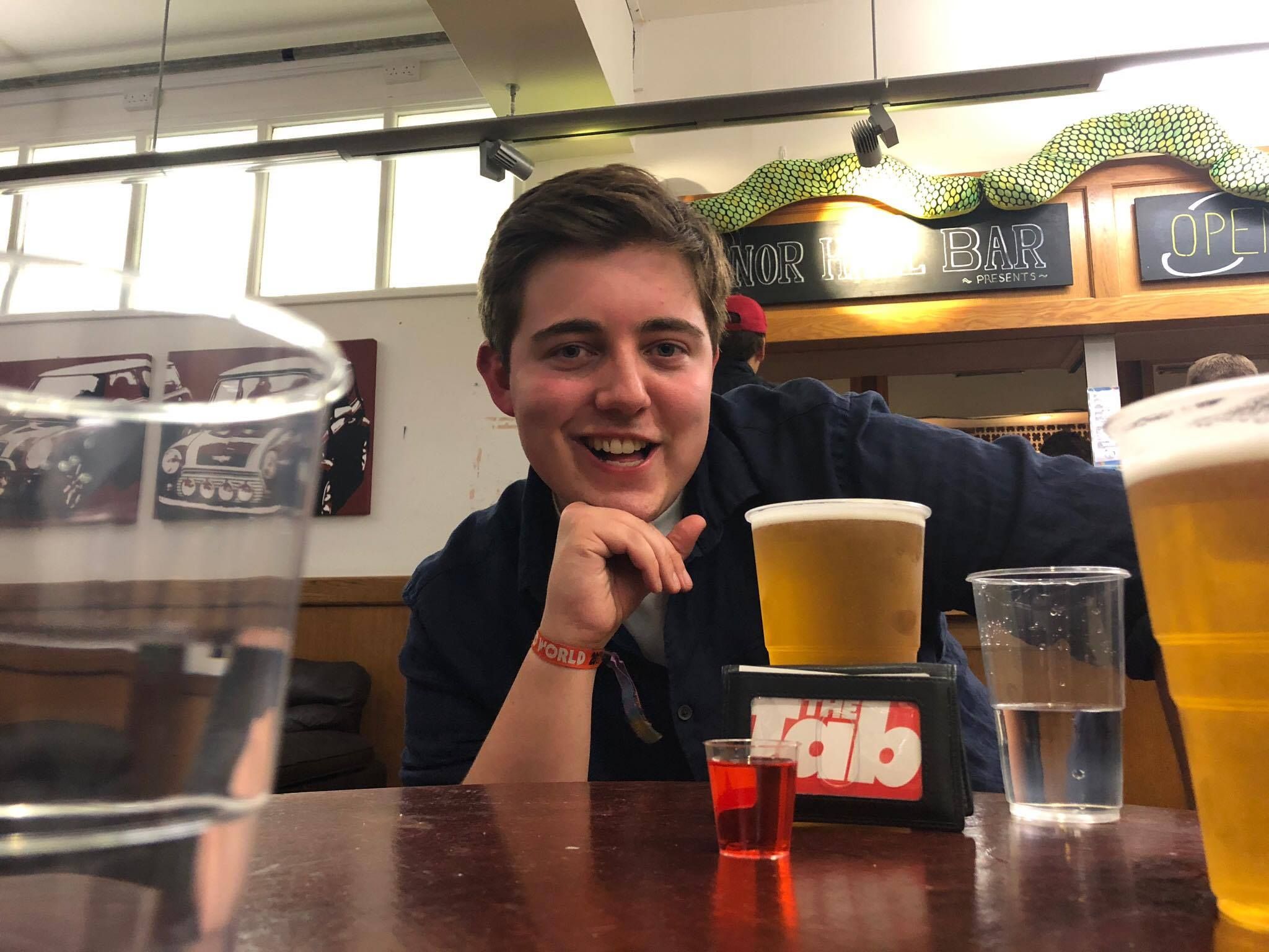 Image may contain: Drink, Diner, Food Court, Cafeteria, Cafe, Glass, Beverage, Beer Glass, Beer, Alcohol, Cup, Human, Person, People, Furniture, Couch