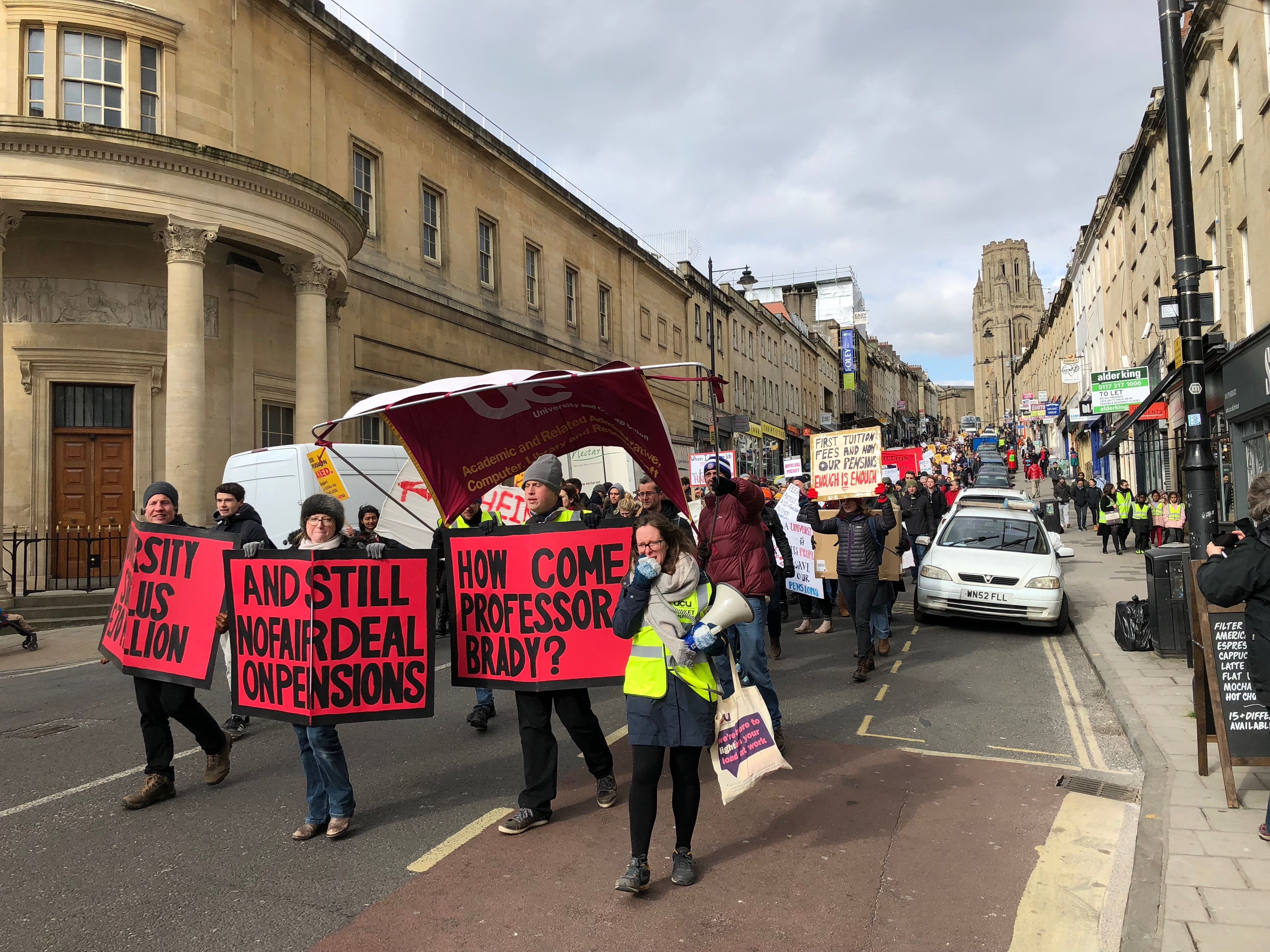 Image may contain: Parade, Crowd, Text, Banner, Person, People, Human