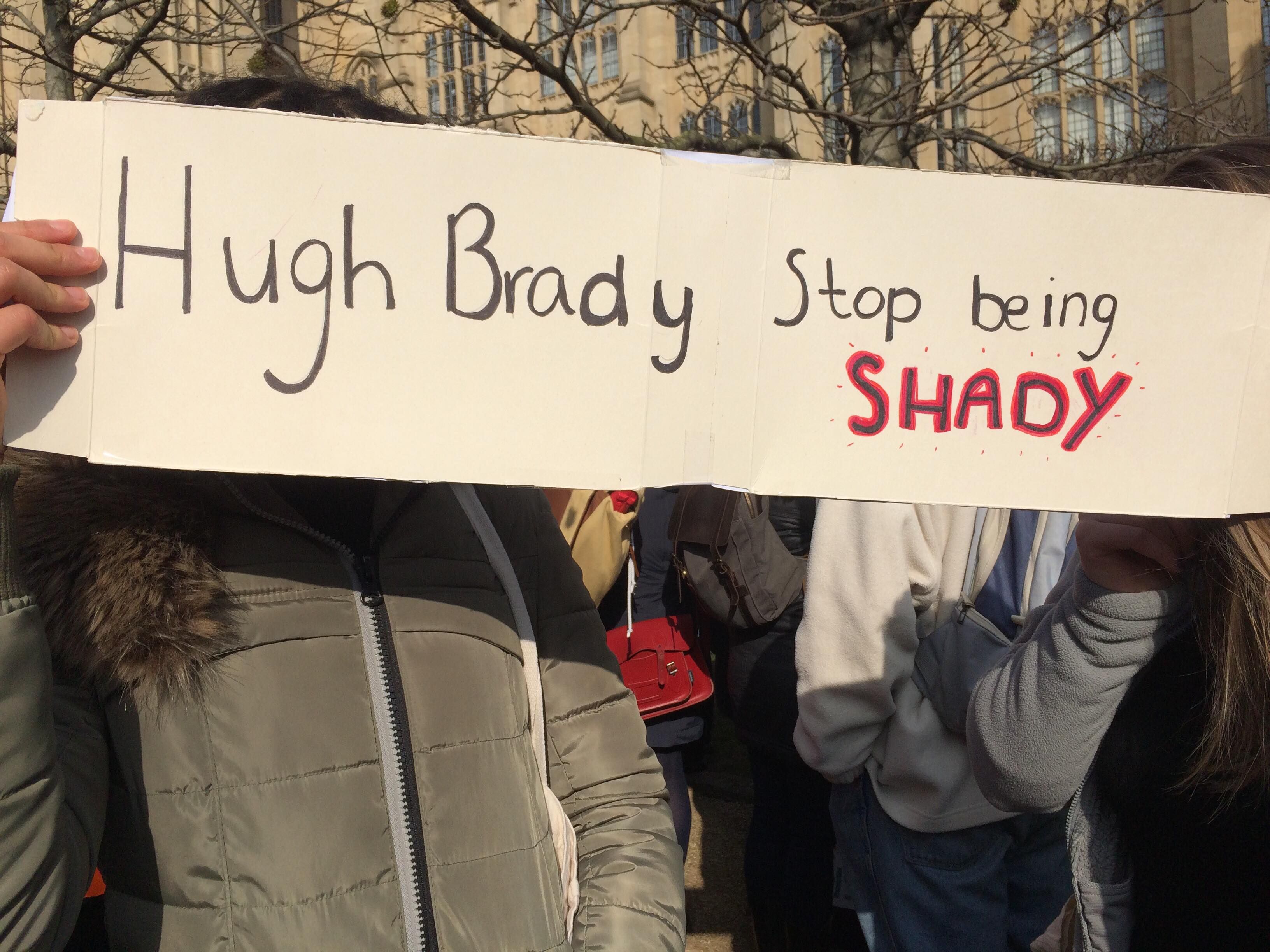 Image may contain: Person, Human, Crowd, Text, Banner