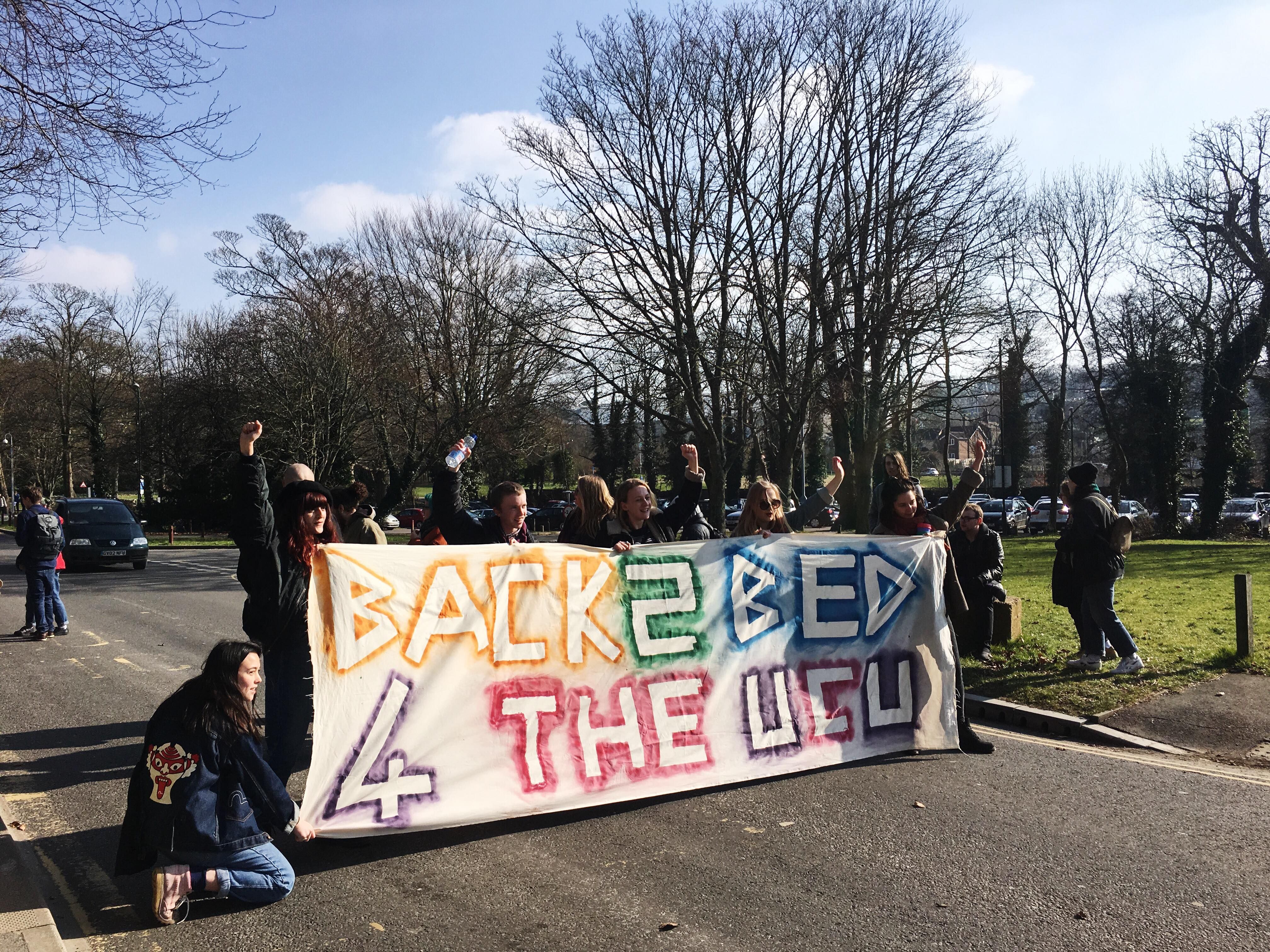 Image may contain: Text, Banner, Person, People, Human