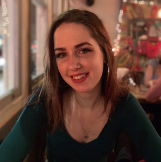 Image may contain: Cafe, Portrait, Photo, Photography, Smile, Meal, Pub, Bar Counter, Food, Food Court, Girl, Teen, Kid, Child, Blonde, Woman, Female, Face, Person, Human, Restaurant