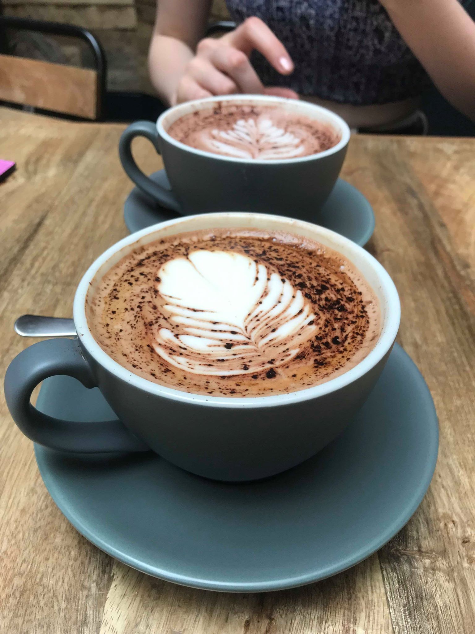 Image may contain: Chocolate, Dessert, Food, Hot Chocolate, Saucer, Pottery, Person, Human, Drink, Latte, Beverage, Coffee Cup, Cup