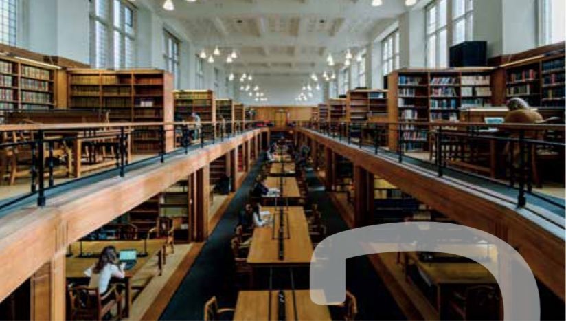 Image may contain: Building, Bridge, Person, Human, Library, Room, Indoors, Book