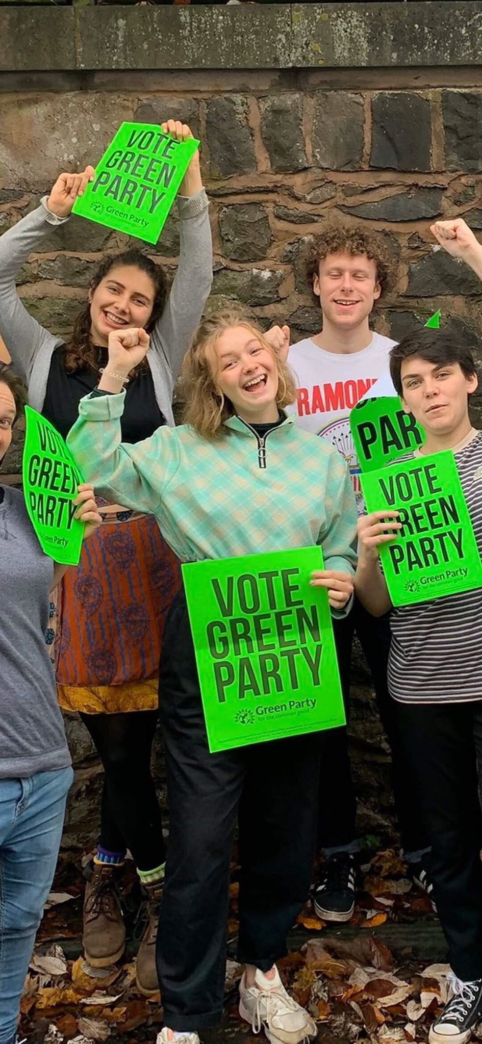 Image may contain: Man, Girl, Crowd, Parade, Text, Portrait, Accessory, Accessories, Glasses, Photo, Photography, Female, People, Face, Footwear, Apparel, Clothing, Shoe, Human, Person