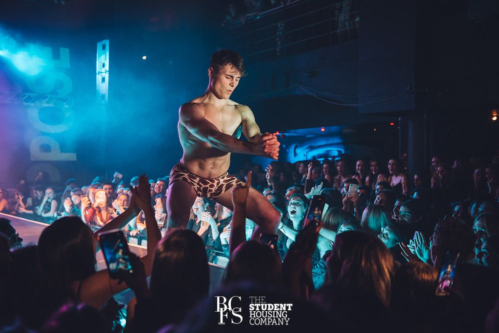 Image may contain: Party, Audience, Crowd, Night Club, Club, Night Life, Human, Person