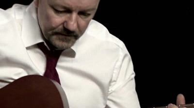 David-Brent-Playing-Guitar