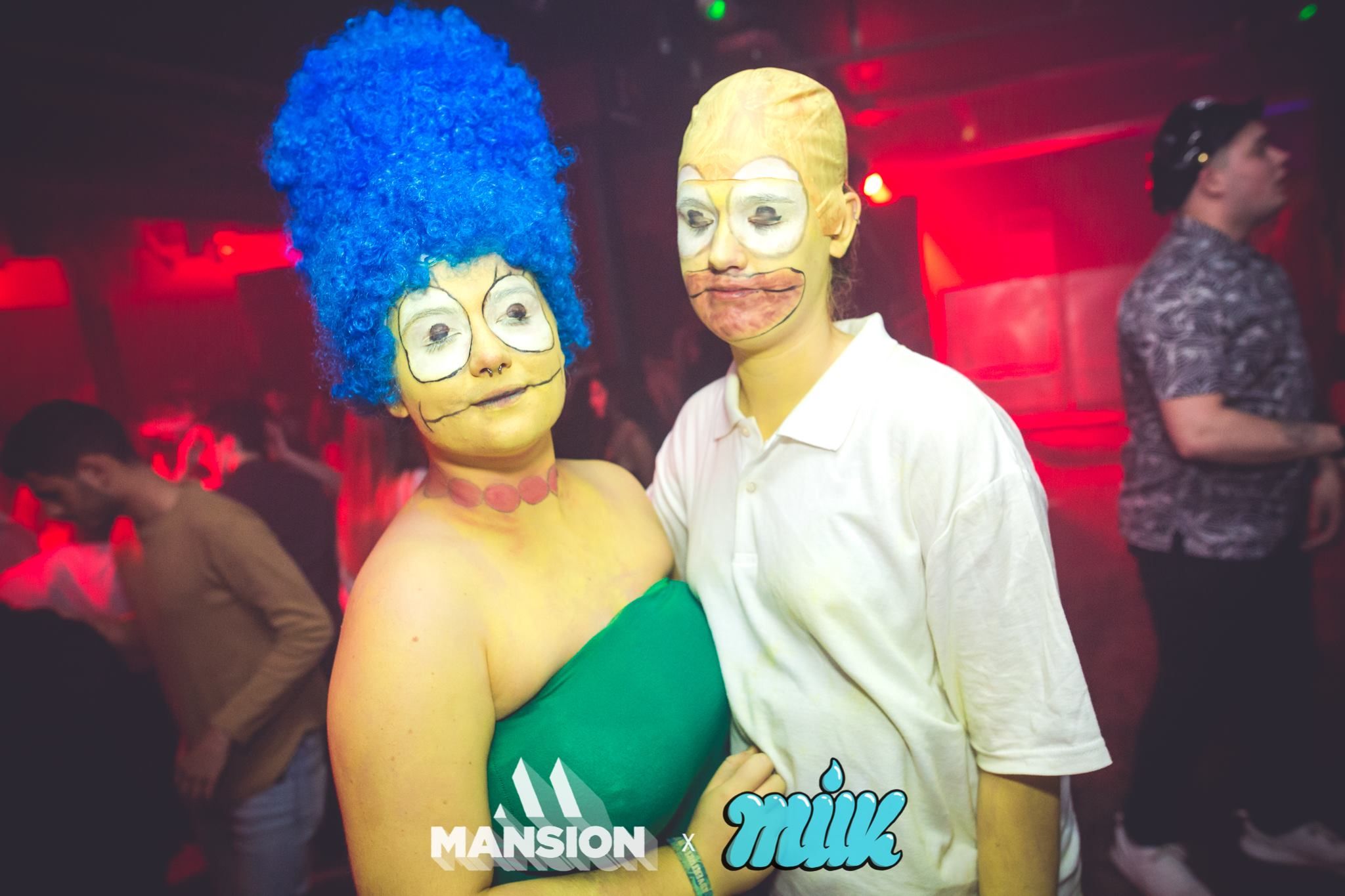 Image may contain: Festival, Club, Performer, Clown, Kiss, Hug, Hair, Afro Hairstyle, Human, Person, People