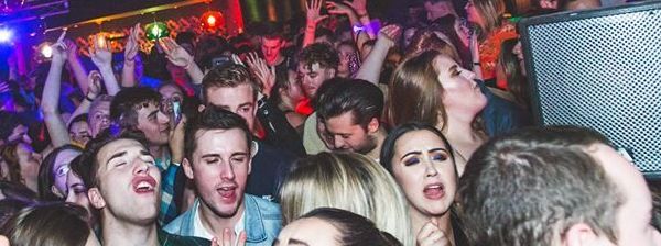 Image may contain: Party, Night Life, Make Out, Person, People, Human