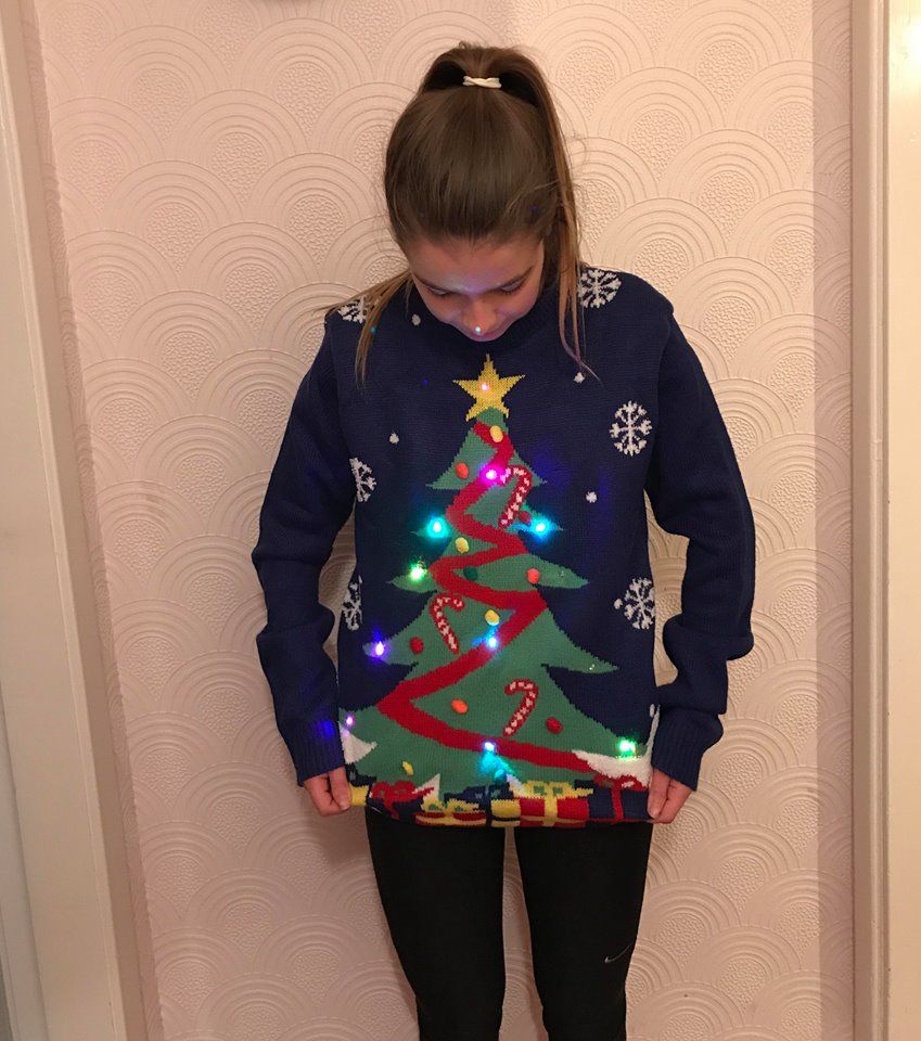 Image may contain: Hoodie, Pants, Sleeve, Plant, Tree, Person, Human, Sweatshirt, Sweater, Apparel, Clothing