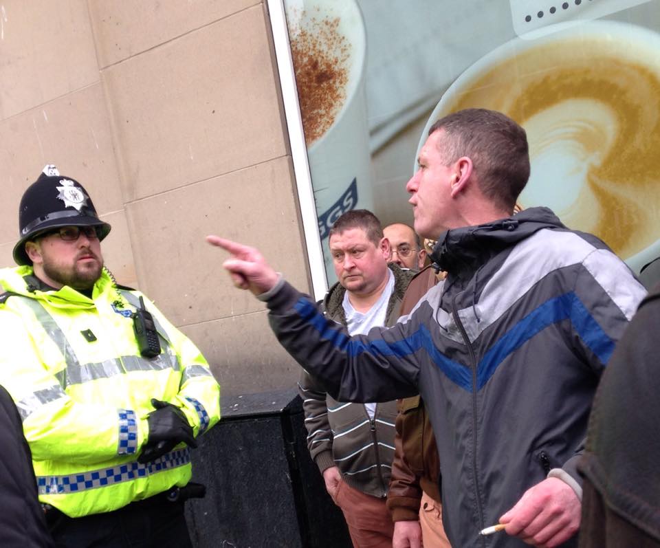 A pegida protester trying to reach the opposing march