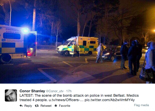 members of public photograph the scene