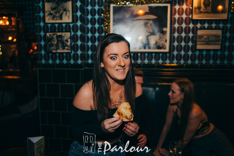 Judging by her facial expression that must be some damn good pizza