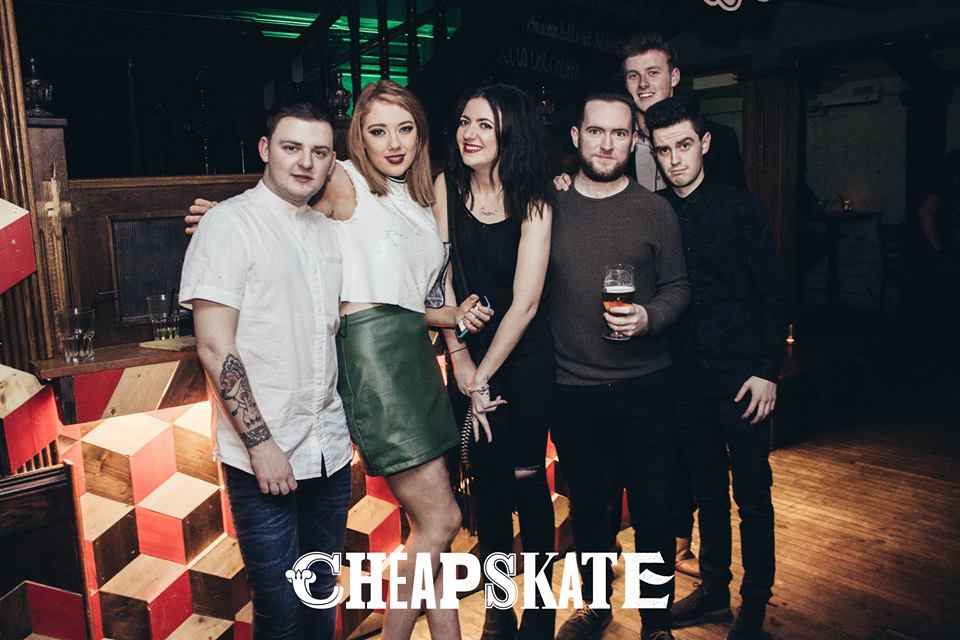 Sending your tall mate to the back of the group photo