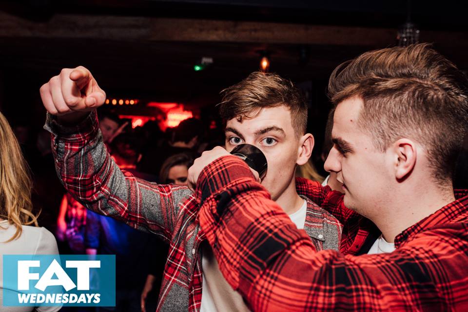 When your friends so drunk you have to feed them the rest of their drink