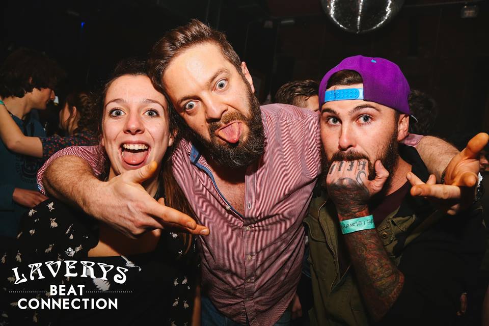 1. Wotsit residue around guy #1's mouth and fingers. 2. Guy #2 must be cleaning his Wotsit residue off his fingers. Sneaky