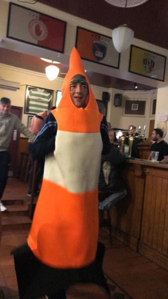 Image may contain: Mascot, Bar Counter, Pub, Indoors, Costume, Apparel, Clothing, Person, Human