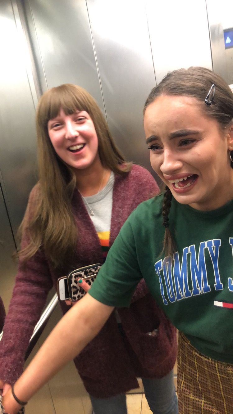 Image may contain: Elevator, Girl, Accessory, Glasses, Accessories, Female, Clothing, Apparel, Smile, Face, Human, Person
