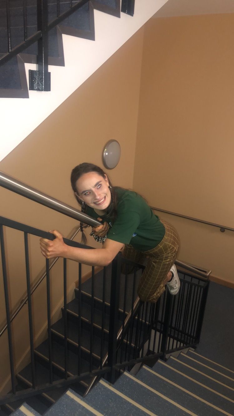Image may contain: Railing, Person, Human, Banister, Handrail