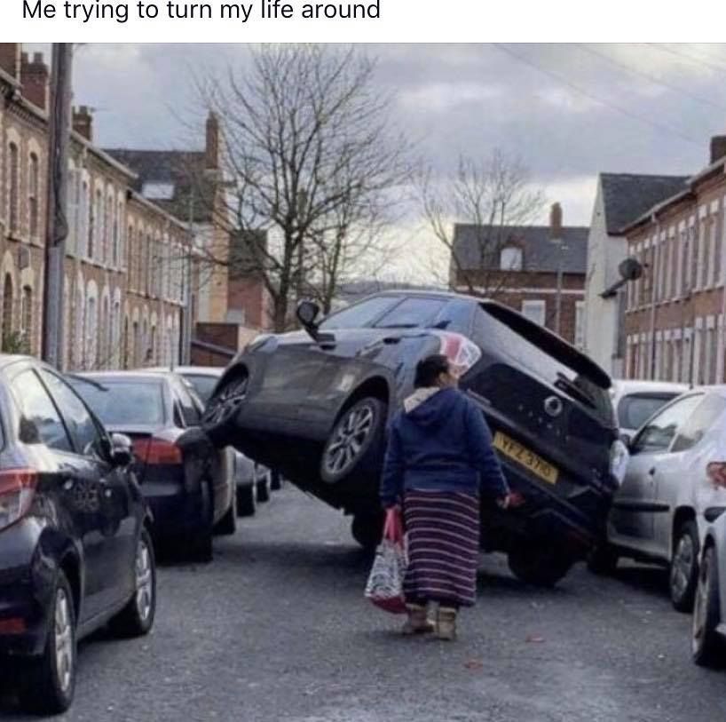 Image may contain: Urban, Sedan, Parking, Parking Lot, Wheel, Machine, Person, Human, Car, Vehicle, Automobile, Transportation
