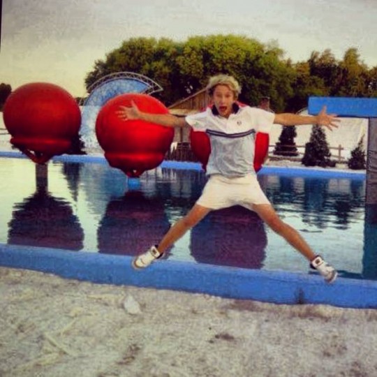 Baz poses in front of the Winter Wipeout course