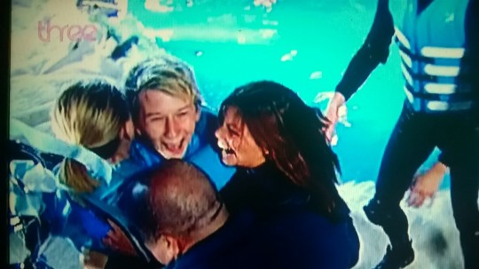 The 19 year-old is mobbed as he is told he has won Winter Wipeout