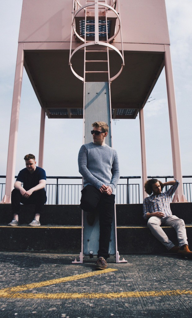 Skip (middle) alongside his band-mates in a press release shoot.