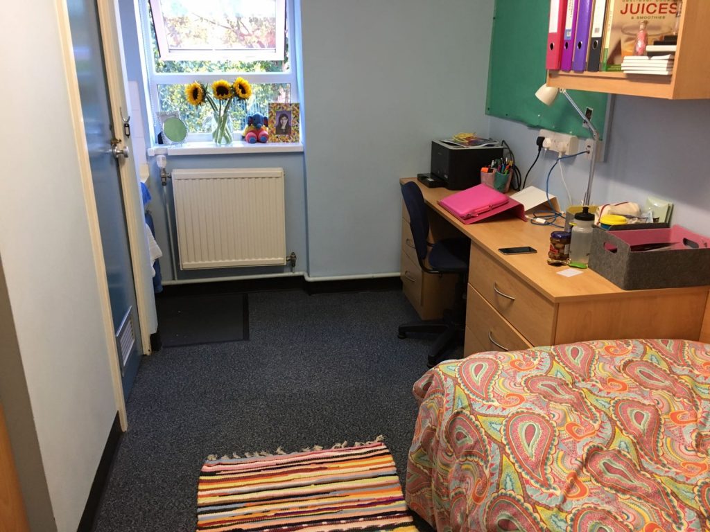 A desk complete with laptop