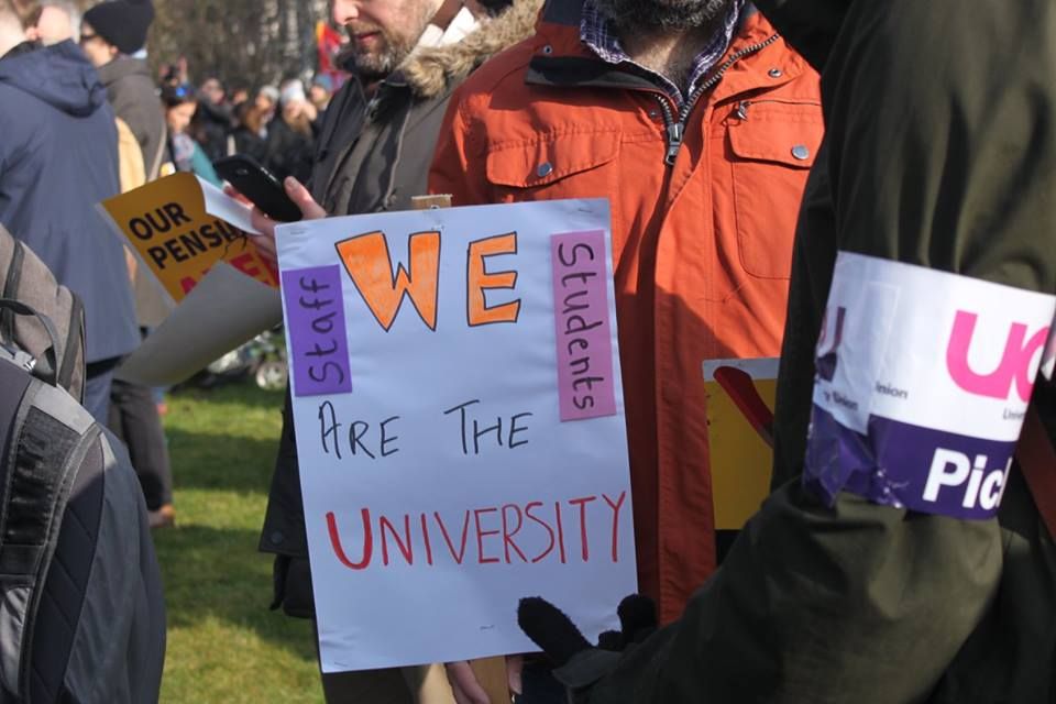 Image may contain: Text, Banner, Beard, Parade, Bag, Crowd, Person, People, Human