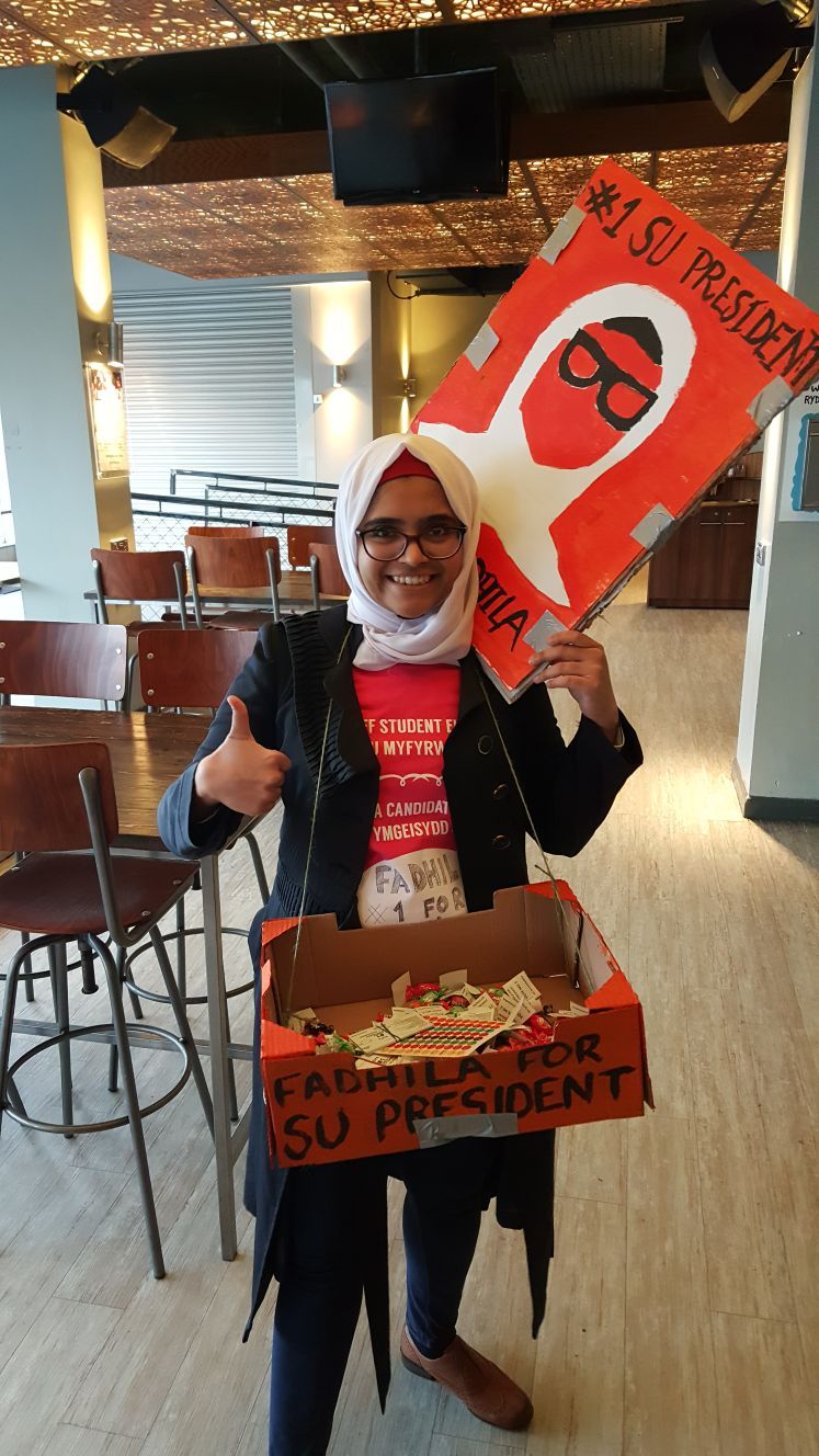 Image may contain: Umbrella, Canopy, Furniture, Chair, Person, People, Human
