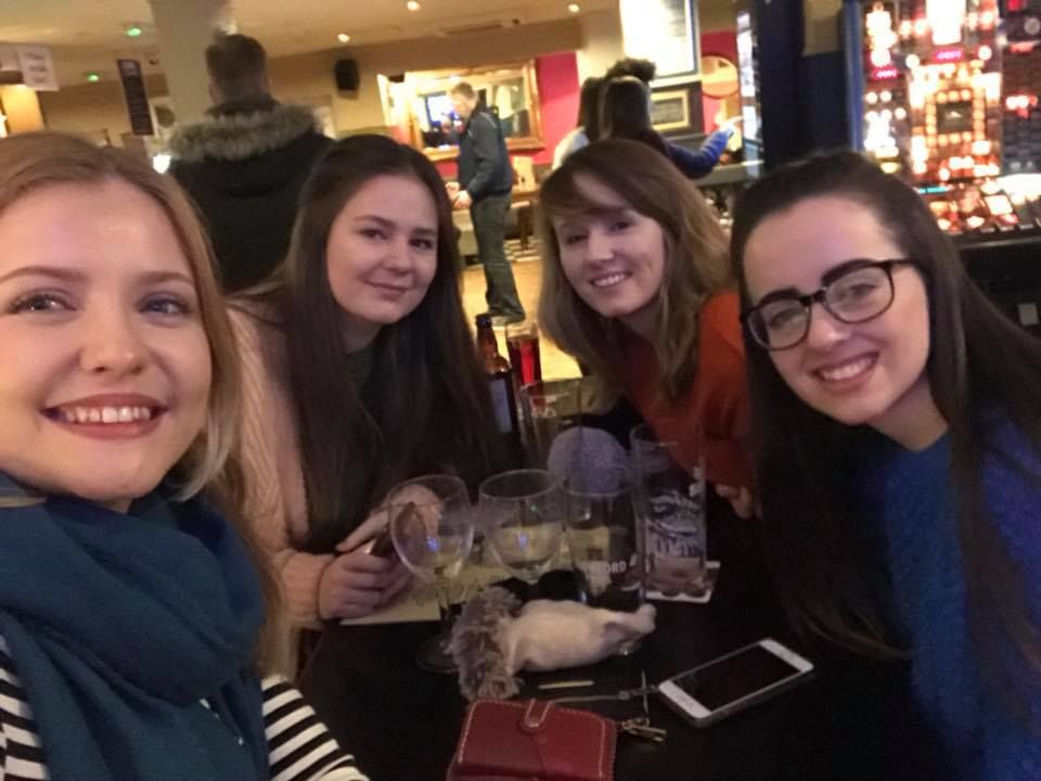Image may contain: Pub, Bar Counter, Smile, Portrait, Face, Glass, Person, People, Human