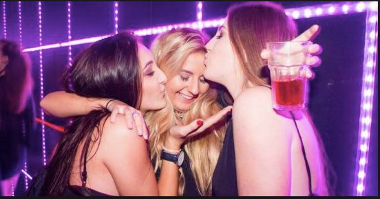 Image may contain: Glass, Night Life, Night Club, Club, Cup, Make Out, Person, People, Human