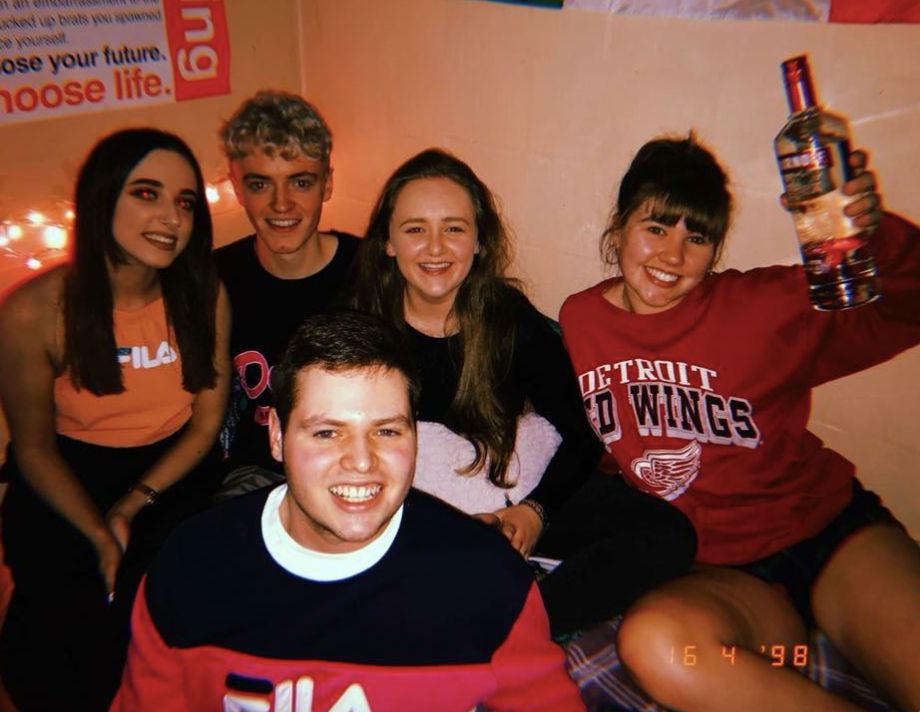 Image may contain: Smile, Portrait, Face, Team, Bottle, Person, People, Human