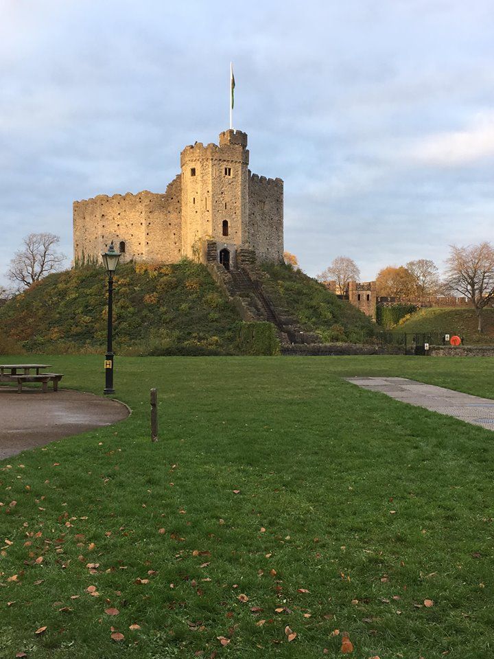 Image may contain: Field, Lawn, Fort, Architecture, Castle, Building, Furniture, Bench, Plant, Grass