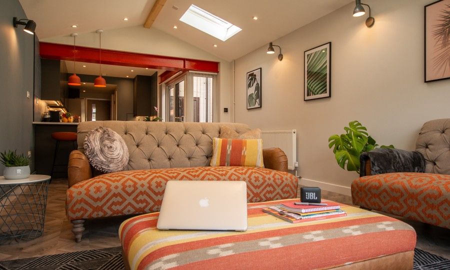 Image may contain: Housing, Skylight, Interior Design, Home Decor, Window, Pc, Electronics, Computer, Laptop, Architecture, Building, Cushion, Couch, Furniture, Room, Living Room, Indoors