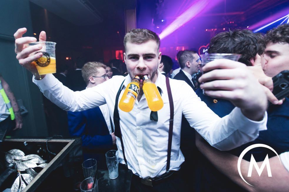 Image may contain: Animal, Bird, Alcohol, Drink, Beer, Beverage, Disco, Party, Night Club, Club, Person, Human