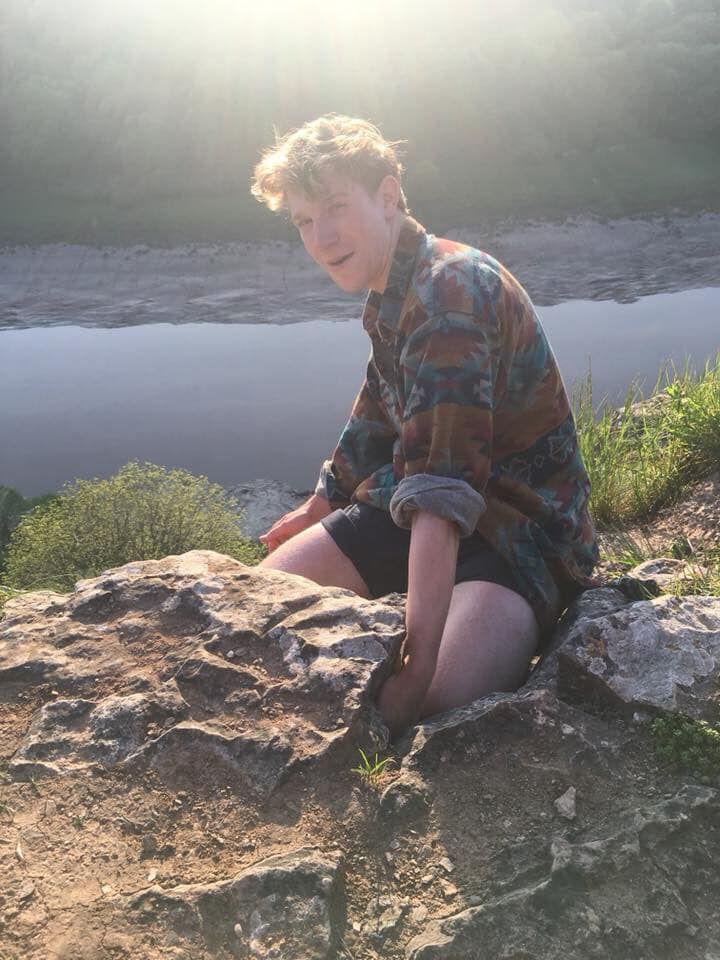 Image may contain: Face, Portrait, Photography, Photo, Female, Pants, Boy, Plant, Cliff, Wilderness, Shorts, Person, Human, Apparel, Clothing, Nature, Outdoors, Rock